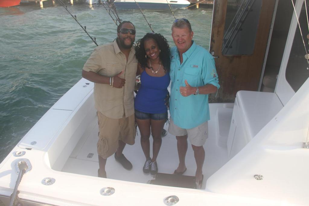 South Carolina Second Chance winner Mailoyn Davis and his guest with Guy Harvey. © John Bell